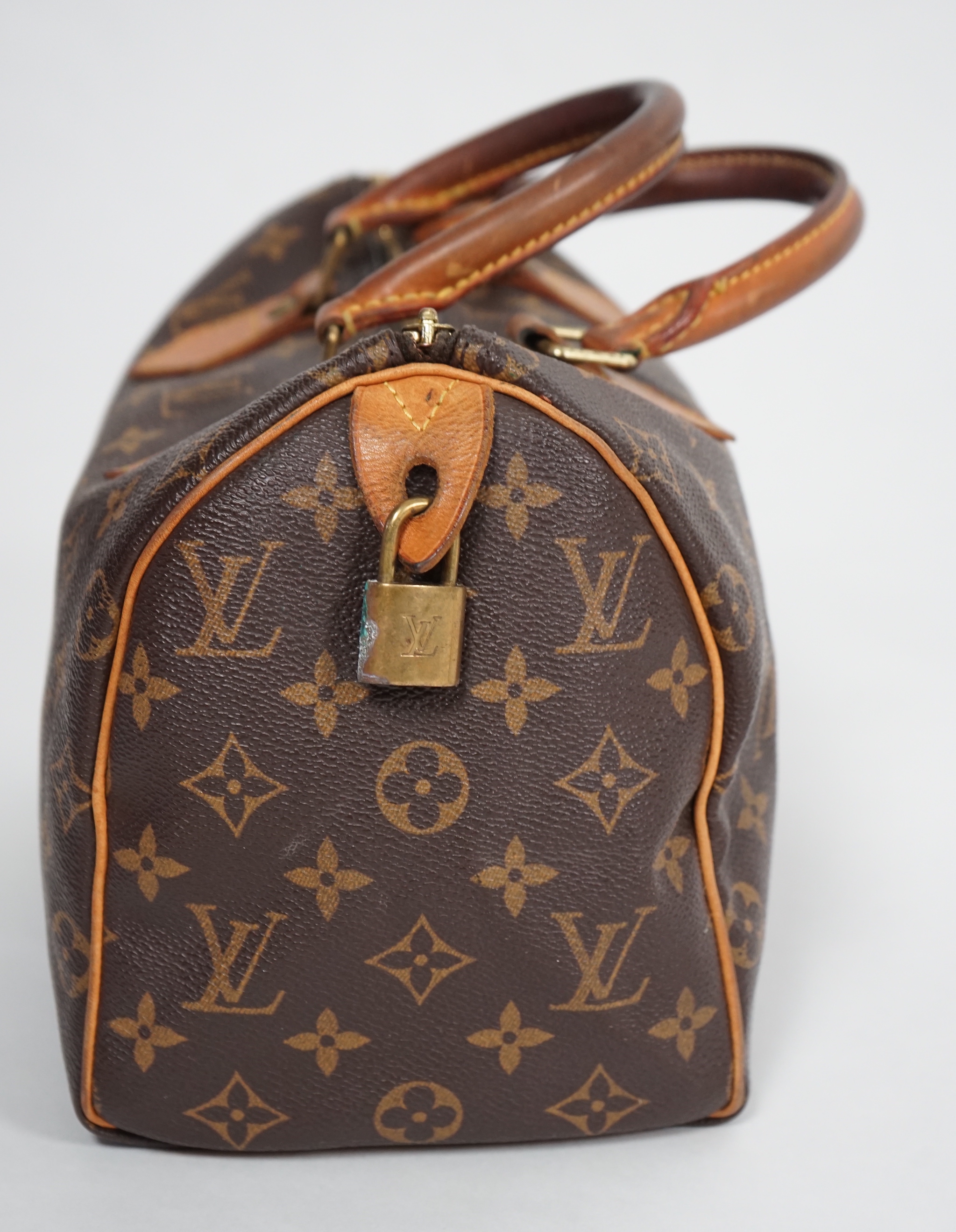 A vintage Louis Vuitton Monogram canvas Speedy 25 handbag, a Louis Vuitton Pochette Accessories Canvas bag and small Agenda PM Speedy bag: width 25cm, height overall 29cmm depth15cm, Pochette Bag: width 22cm, height 13cm